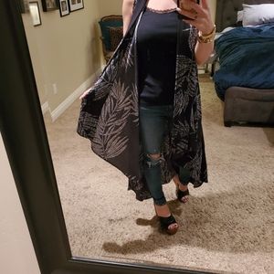 Black and white long tank style cover all